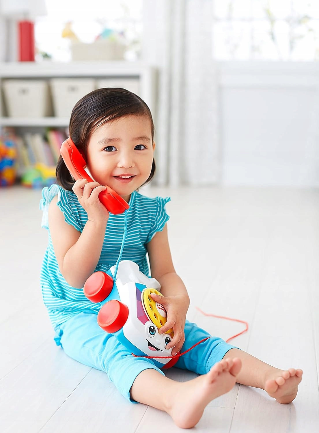 FISHER-PRICE telephone with a dial to turn and a string to pull