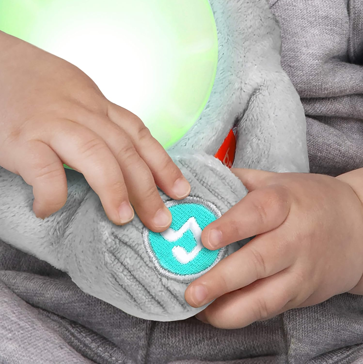 BRIGHT STARTS Huge-a-bye-Baby interaktiver Elefant mit Musik und Lichtern 20 cm